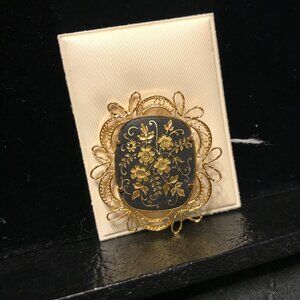 gold brooch